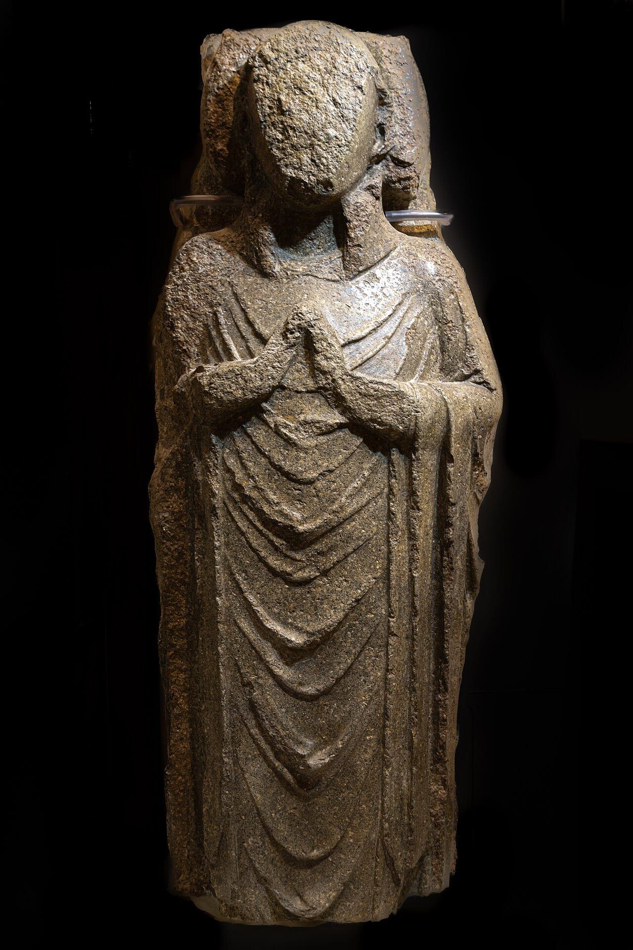Coffin lid carved with a priest in Purbeck Marble (13th century), Shaftesbury Abbey Museum